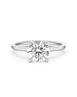 A 1.50 carat diamond four-prong solitaire ring in white gold, front view, isolated on a white background