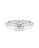A 1.00 carat diamond four-prong solitaire ring in white gold, front view, isolated on a white background