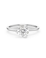     A Pyramide diamond solitaire ring set with a 1.00 carat GIA certified round brilliant cut diamond in white gold, front view, isolated on a white background