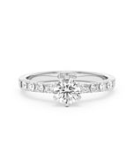 A Blanche-Neige diamond solitaire ring set with a 0.50 carat GIA certified round brilliant cut diamond in white gold, front view, isolated on a white background